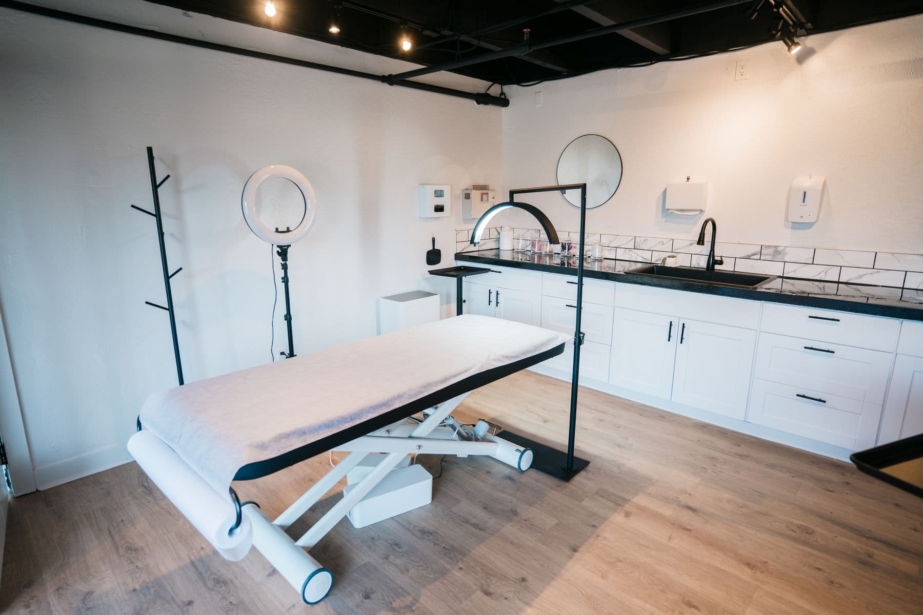 Private aesthetic clinic room with warm lighting and a calm clinical atmosphere